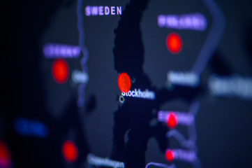 Sweden, Stockholm. Coronavirus COVID-19 global cases Map. Red Point showing the number of infected. World map on monitor display.