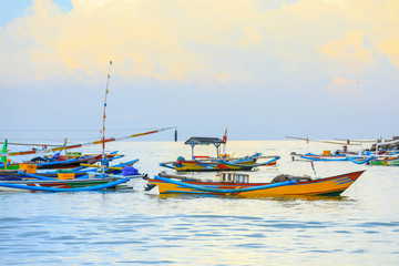 Naklejka na ściany i meble Colorful handcrafted Balinese wooden fishing boat at port in Jimbaran beach, Bali 
