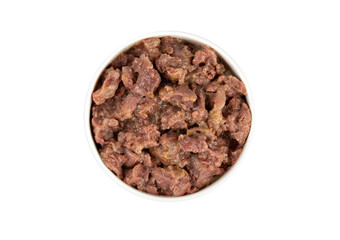 Canned pet food in round white bowl isolated on white, top view.
