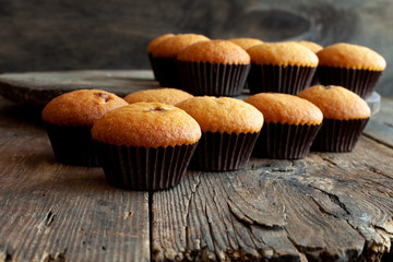 Muffins - delicious pastries. Delicious dessert on the table - homemade muffins. Portioned cupcakes. Simple muffin.