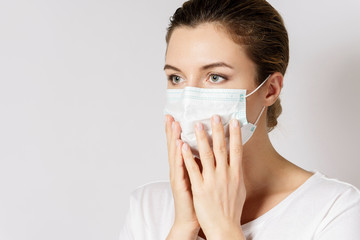 Young woman is wearing a face mask for protection against virus