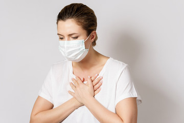 Young woman is wearing a face mask for protection against virus