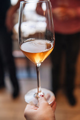 A glass of super-natural wine in hand