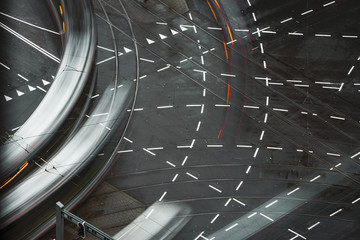 Fast blurred trail of train in traffic motion in illuminated metro, Netherlands.