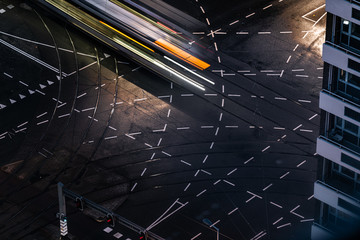 Fast blurred trail of train in traffic motion in illuminated metro, Netherlands.