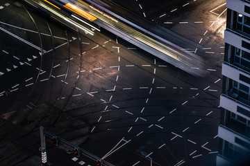 Fast blurred trail of train in traffic motion in illuminated metro, Netherlands.