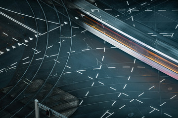 Fast blurred trail of train in traffic motion in illuminated metro, Netherlands.