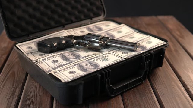 Man hands open suitcase with cash dollar