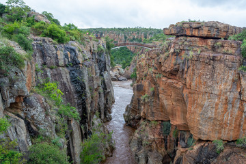 carved mountains from river at the canyon from bourke's luck potholes  at the panorama route south africa