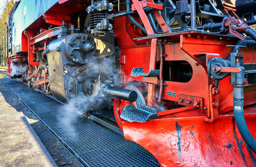 Detail of the technology of a steam locomotive at the train station.