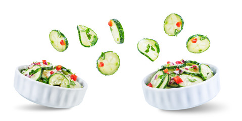 Cucumber spice salad with red onion nd red pepper on a white isolated background