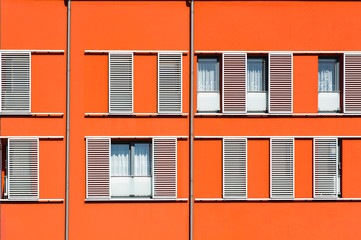Orange facade of modern residential building
