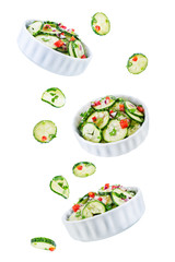 Cucumber spice salad with red onion nd red pepper on a white isolated background