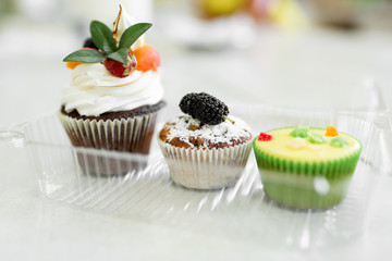 Plate with freshly baked sweet muffins. Sweet pastries, recipes, cooking