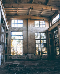 A large broken window in an old destroyed building. Old ruined haunted house, abandoned house. The lost city of Pripyat. Chernobyl - image.