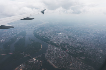Fototapeta na wymiar Kiev city with airplane window, Ukraine