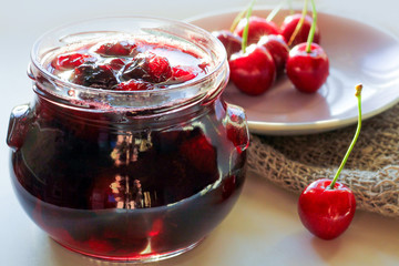 freshly brewed jam at home from summer cherries in a glass jar