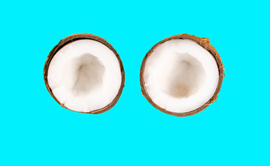 two halves coconut on blue background