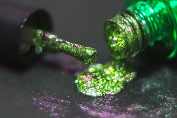 makeup brushes on golden glitter texture and design. On a black background. Glitter Decor Brush....