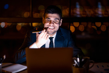 Office Manager Guy Using Voice Assistant On Smartphone In Office