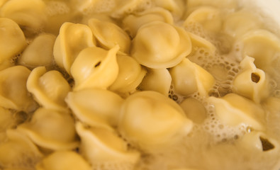 The preparation of dumplings. Boiling water in a pot. The recipe for the dumplings. Traditional food.