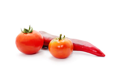 Ripe red tomatoes and pepper.