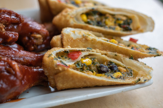 Vegetable Egg Rolls and Chicken Wings