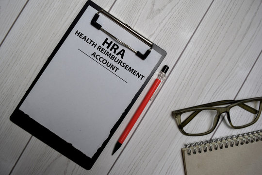 HRA - Health Reimbursement Account write on a paperwork isolated on office desk.