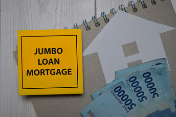 Jumbo Loan Mortgage write on a sticky note isolated on Office Desk.