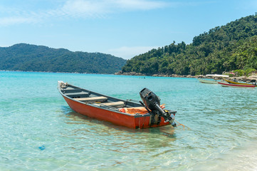 Boats with clear water and blue skies at Perhentian Island, Malaysia