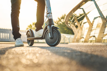 Close up image of man on electric scooter © InsideCreativeHouse