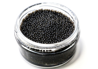 Black sturgeon caviar on a white background.