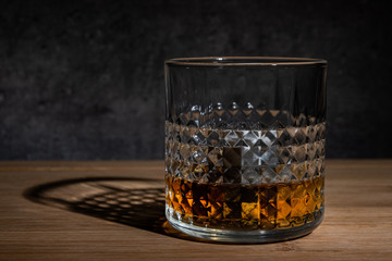  Glass of whisky on concreete background
