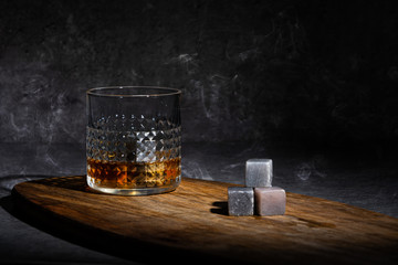  Glass of whisky on concreete background