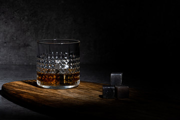  Glass of whisky on concreete background