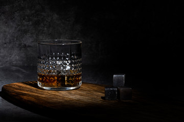  Glass of whisky on concreete background