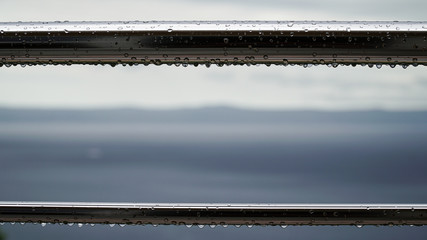 Drops of water after rain on metal pipes.