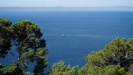 Fototapeta na wymiar Beautiful sea view with a single boat. Holidays in Croatia.