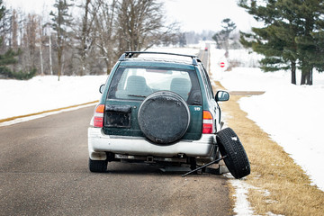 broken down abandoned SUV country road