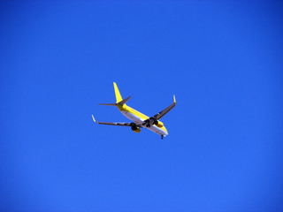 Fototapeta na wymiar Airplane in the blue sky