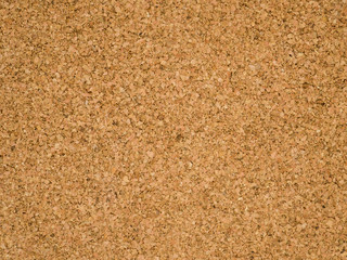 Corkboard background. Brown paper texture. Abstract pattern. Wood backdrop. Cardboard wall. Plywood. Untreated cork panel