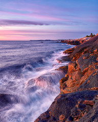 sunset on coast of sea