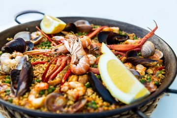 Very tasty seafood paella in the frying pan, traditional spanish food
