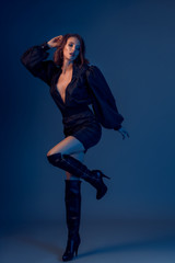 Portrait of beautiful brunette woman in black dress. Fashion photo,.