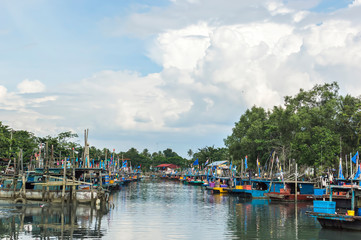 Fototapeta na wymiar Boats at fisherman village under the blue skies