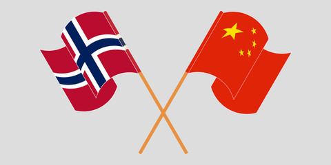 Crossed and waving flags of Norway and China