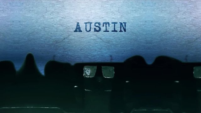 AUSTIN Word closeup Being Typing and Centered on a Sheet of paper on old vintage Typewriter mechanical 4k Footage Background Animation.
