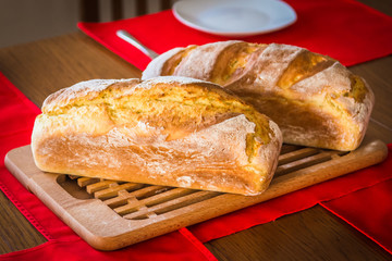 Two home madee bread loafs cooling in the early spring morning day.