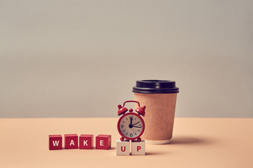 Morning coffee. Beginning new day. Awakening. Good morning. Wake up inscription. Alarm clock, paper...