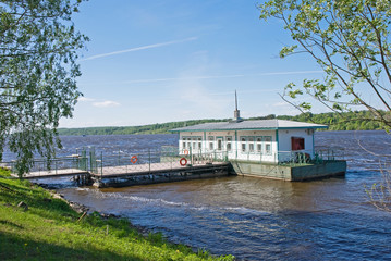 Fototapeta na wymiar A small pier on the Volga river on a Sunny summer day, Ples, Russia